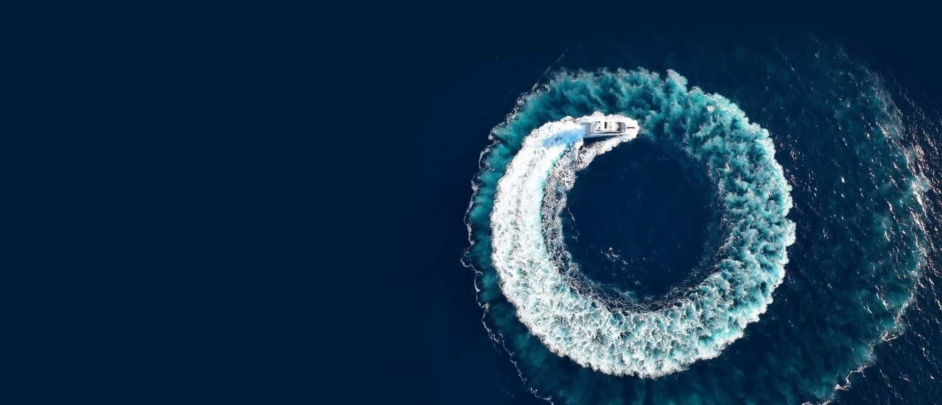 Yacht creating circular wake